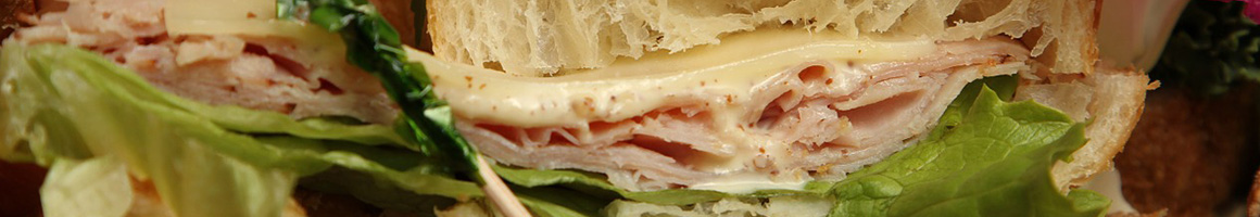 Eating Sandwich Vegan Salad at PlantPure Cafe.
